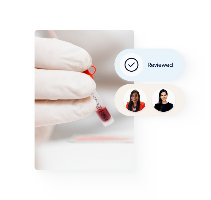 Hand in white glove is holding a small blood sample. Message pop up saying 'Reviewed' with a tick next to it. Two doctors' faces in a pop up underneath.